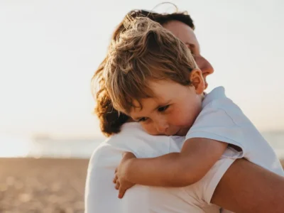 A child being comforted by an adult