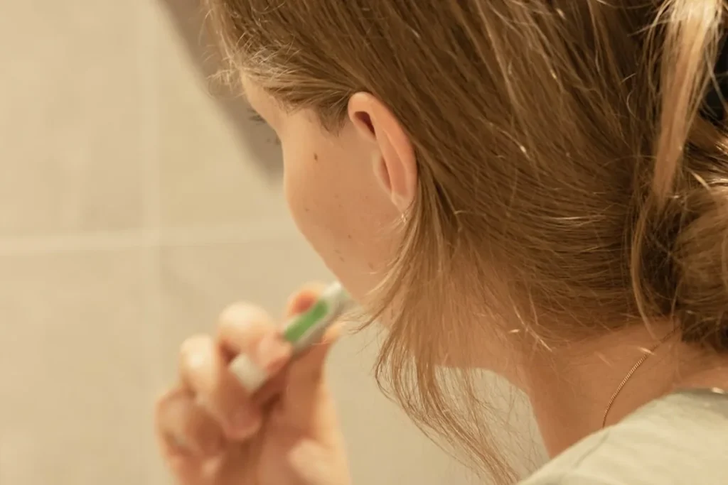 A child brushing their teeth
