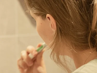 A child brushing their teeth