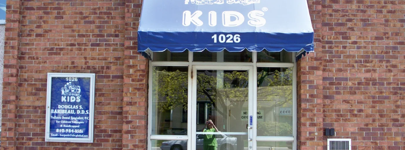 Exterior of the practice at 1026 Superior Street, Port Huron, with a blue KIDS awning over the entrance