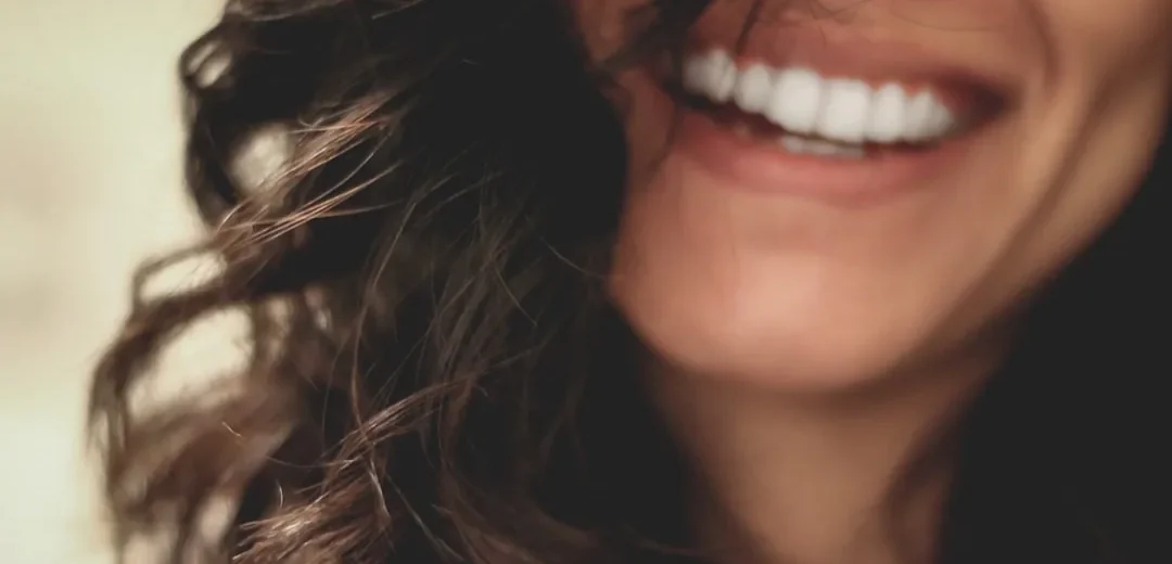 An adult with a healthy smile
