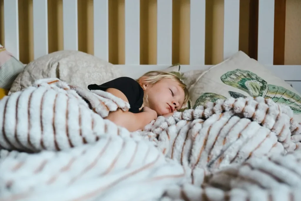 A child asleep in bed