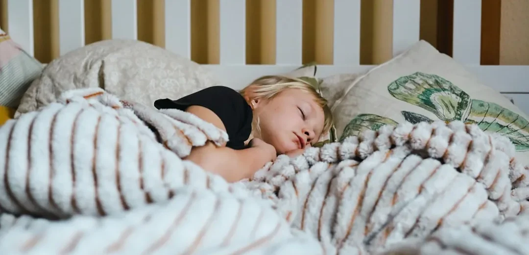 A child asleep in bed